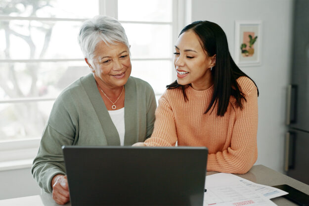 Helping Your Parents Navigate Their Senior Living Options a woman helps her aging mother explore her senior living options