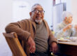 Senior man sitting at table