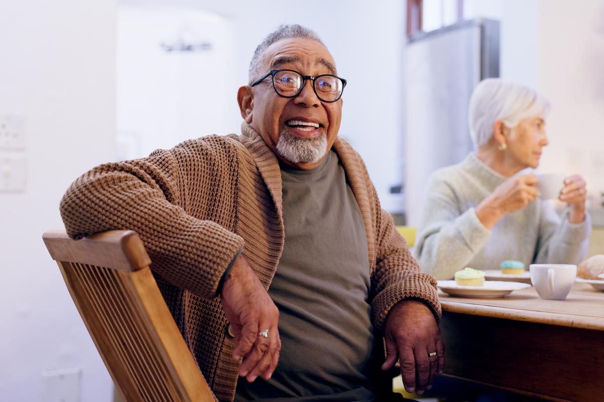Senior man sitting at table