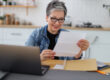 Senior woman reading paperwork