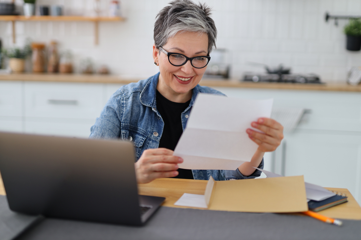 Senior woman reading paperwork