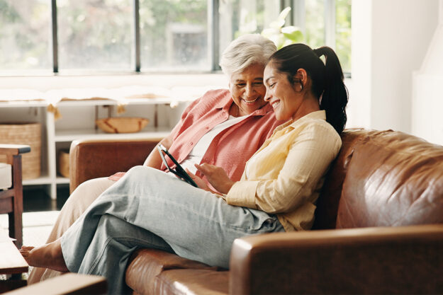 What Is Short-Term Assisted Living – Image 1 – Cedarbrook Child showing senior parent living options on phone